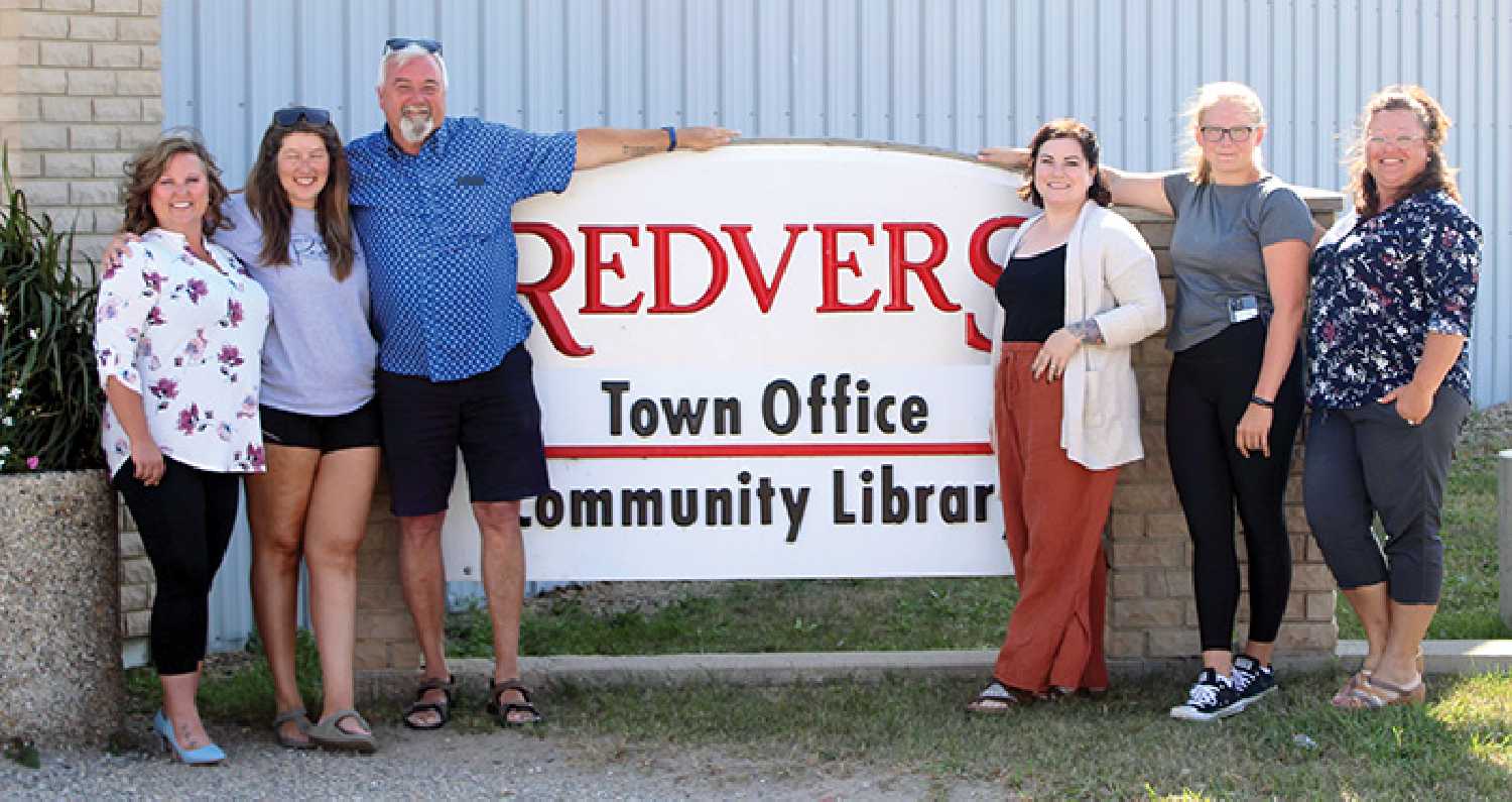 Where else would you want to pose for a photo when your name and the towns are the same? From left are Tricia Pickard, Dayna Germain, Redvers McGrath, Jena Cowan, Kaylee Ohnander, and Raylene Gordon.